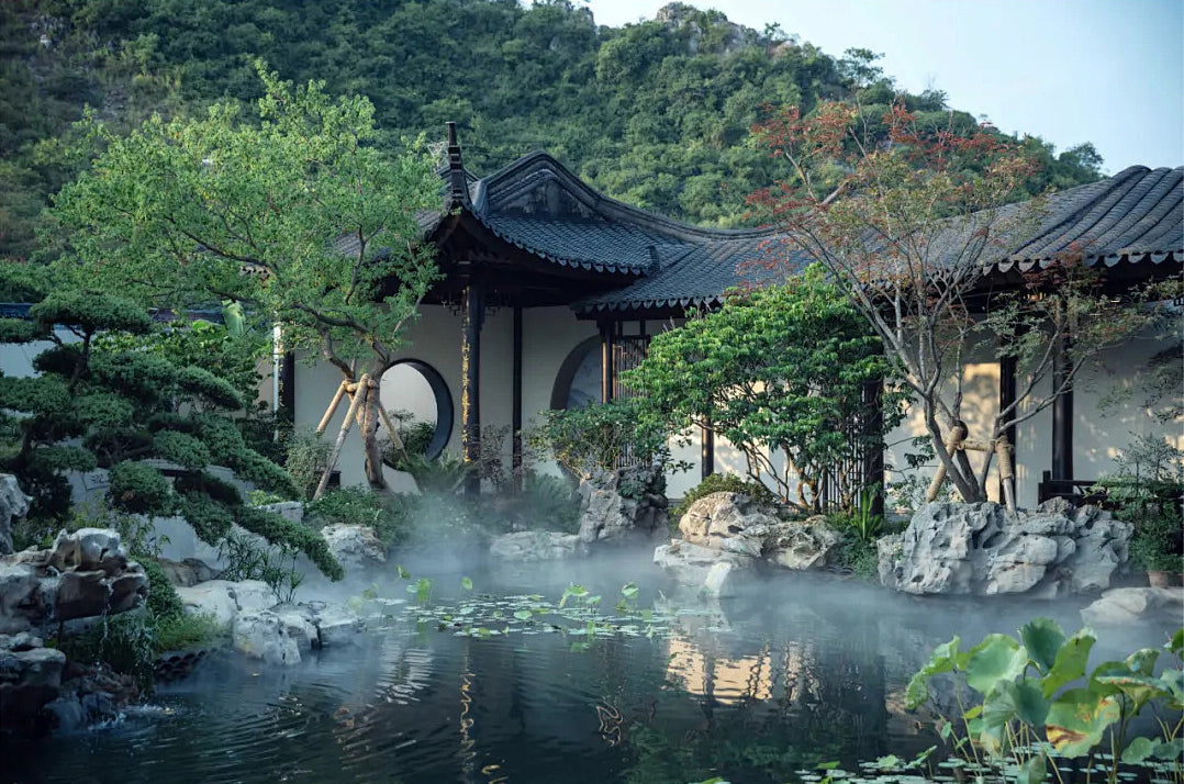 A traditional Jiangnan courtyard with classical Chinese garden architecture, elegant pavilions, and serene landscaping