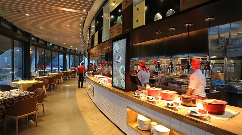 Interior view of the revolving buffet restaurant inside the Oriental Pearl Tower, offering skyline views of Shanghai
