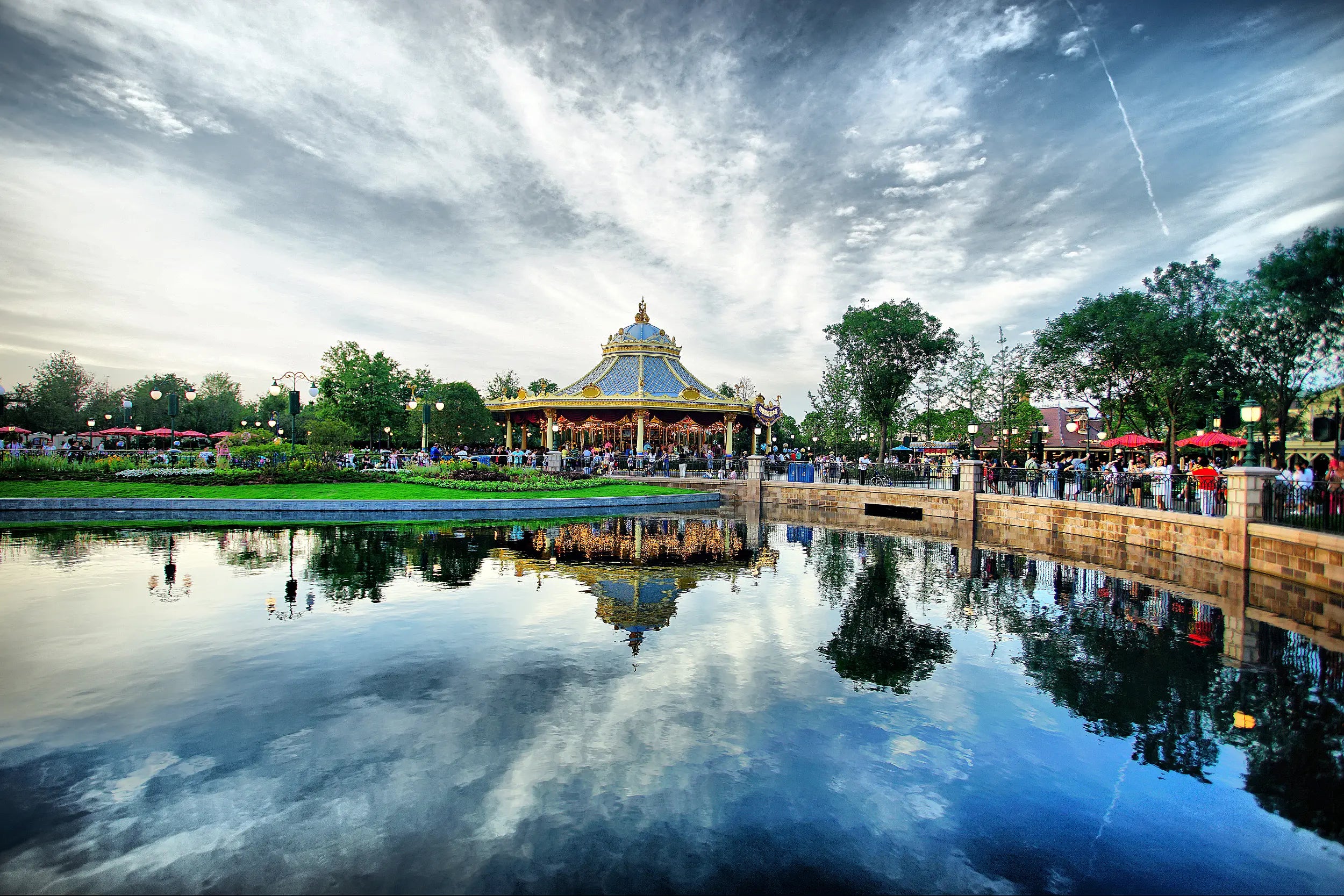Riverside carousel at Shanghai Disneyland near the tranquil river