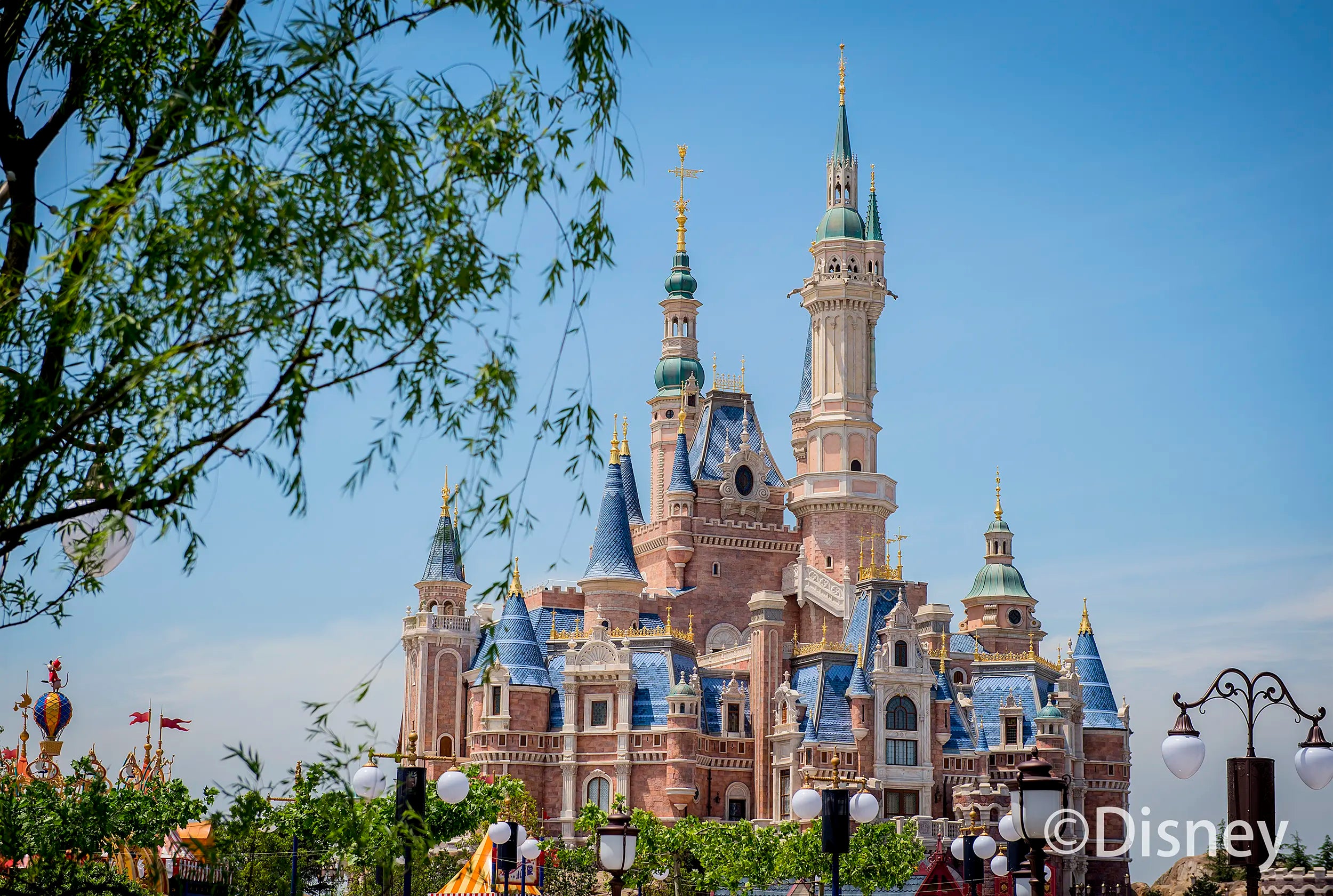 Enchanted Storybook Castle under a clear blue sky at Shanghai Disneyland