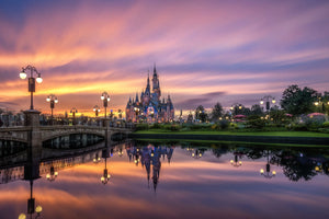 Enchanted Storybook Castle at dusk with a bridge and river at Shanghai Disneyland