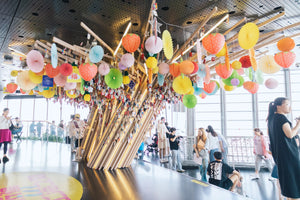 Close-up of handwritten wish cards tied to the Wishing Tree at Shanghai Tower