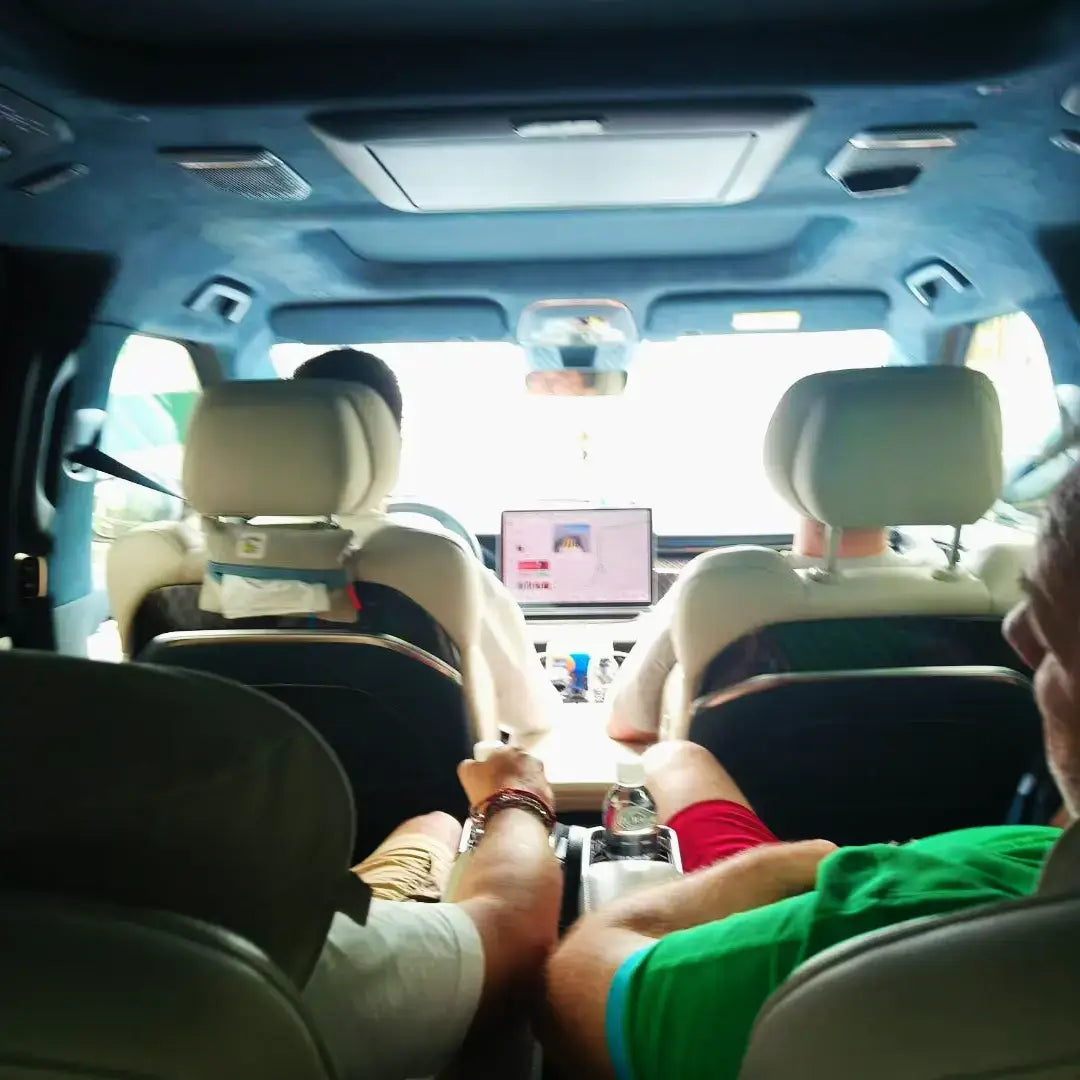 Passengers enjoying a Shanghai First-Time Visitor Day Tour in a comfortable vehicle interior.