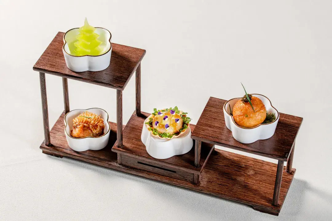 Several plates of exquisite and flavorful Chinese dishes beautifully presented at The Bund, Shanghai.