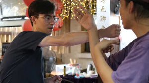 Students practicing Siu Nim Tao form during Wing Chun class
