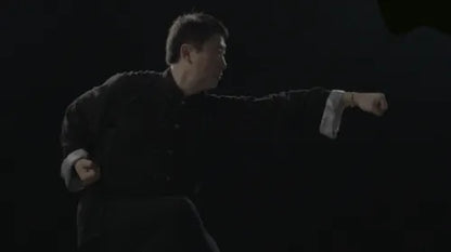 Close-up of a Kung Fu master demonstrating a powerful punch during training in Shanghai.