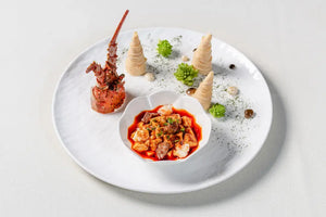 A dish featuring lobster meat and tofu, elegantly plated for the immersive dining experience at The Bund, Shanghai.