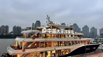 Nanpu Bridge illuminated at night during Huangpu River cruise