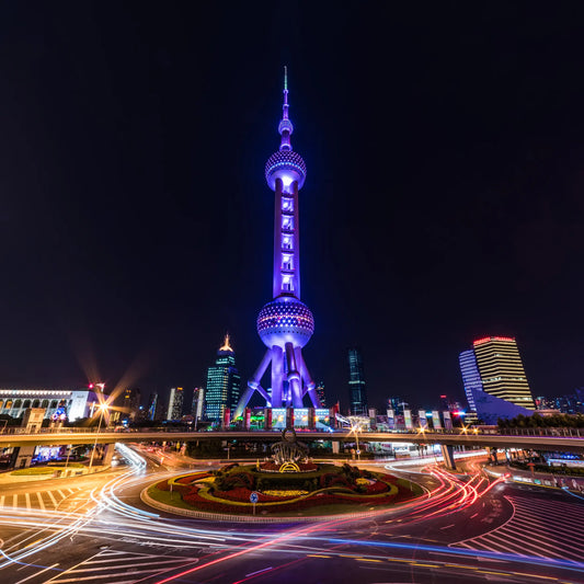Oriental Pearl Tower illuminated at night in Shanghai’s skyline