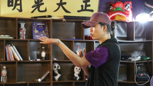 Instructor teaching footwork techniques in Wing Chun class