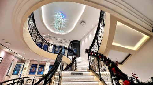 Shanghai Tower lit up at night from the cruise ship deck