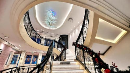 Shanghai Tower lit up at night from the cruise ship deck