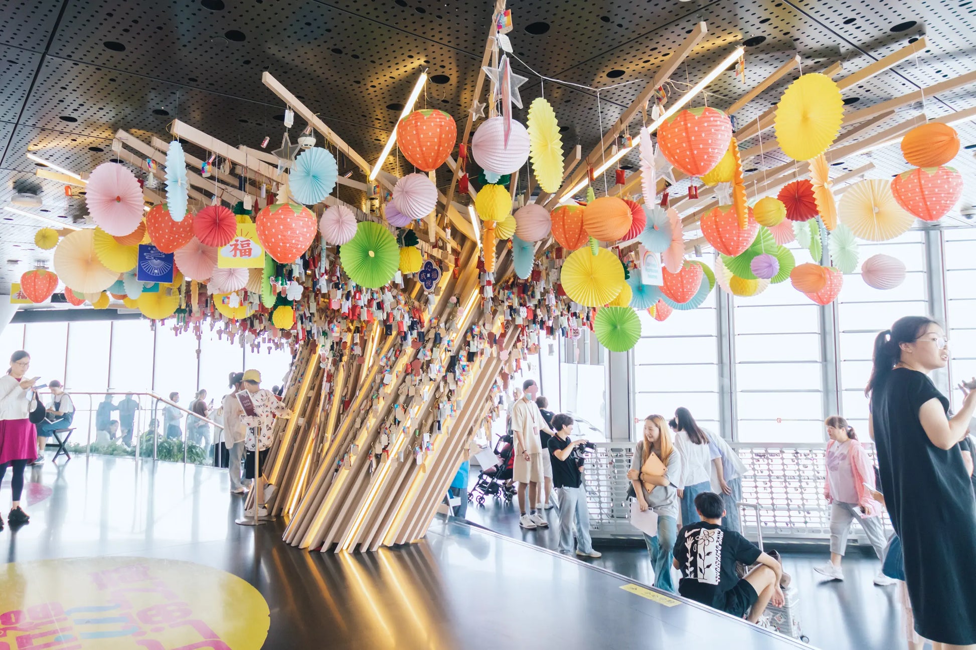 Close-up of handwritten wish cards tied to the Wishing Tree at Shanghai Tower